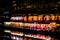 Fenghuang, China - May 14, 2017: People in food court on riverside near Phoenix Hong Bridge in Fenghuang