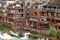 Fenghuang, China - May 15, 2017: People in food court on riverside near Phoenix Hong Bridge in Fenghuang