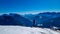 Ferlacher Horn - Man on panoramic hiking trail on way to snow covered mountain peak Ferlacher Horn in Carinthia