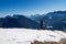 Ferlacher Horn - Man on panoramic hiking trail on way to snow covered mountain peak Ferlacher Horn in Carinthia