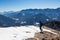 Ferlacher Horn - Man on panoramic hiking trail on way to snow covered mountain peak Ferlacher Horn in Carinthia