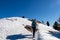 Ferlacher Horn - Woman on panoramic hiking trail on way to snow covered mountain peak Ferlacher Horn