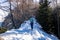 Ferlacher Horn - Woman on panoramic hiking trail on way to snow covered mountain peak Ferlacher Horn