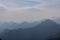 Ferlacher Spitze - View from near Mittagskogel on the alpine mountain chains shrouded in the morning fog in Carinthia