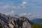 Ferlacher Spitze - View on the summit of Spik and Mangart with the alpine mountain chains in Carinthia, Austria