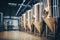 Fermentation mash vats or boiler tanks in a brewery factory. Brewery plant interior. Factory for the production of beer. Modern