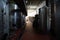 Fermentation tanks and barrels of wine in cellar in Santorini.