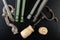 Fermentation tube and corkscrew on a black table. Accessories needed to prepare homemade wine