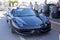 Ferrari, Luxury cars parked next to yachts in the marina of Estepona, Malaga, Costa del Sol, Spain