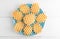 Ferratelle or pizzelle a traditional dessert or cookies from Abruzzo on a blue plate on a white wooden background