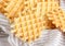 Ferratelle or pizzelle a traditional dessert or cookies from Abruzzo on a cotton napkin on light background,