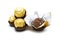 Ferrero Rocher is premium chocolate ball sweets filling with nuts and luxury delicious. Italian chocolate candies isolated on whit