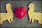Ferret cookies on wooden table with red heart