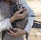 Ferret on a leash in the hands of the hostess