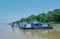 Ferries moored along the bank of a river