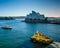 Ferries pass by Sydney Opera House at dawn