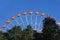 Ferris Wheel against blue sky.