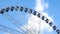 Ferris wheel against blue sky 4k footage real time