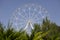 Ferris wheel against blue sky background Panoramic view