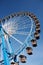 Ferris wheel against clear blue sky