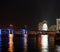 Ferris wheel at Bayside Miami with neon bridge