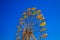 Ferris wheel on blue sky