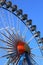 Ferris wheel on blue sky background