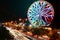 Ferris wheel and blurry night traffic lights