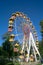 Ferris wheel and bright clear blue sky in the background.