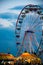 Ferris wheel carnival ride and colorful tents at a fair