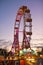 Ferris wheel in the evening in the large amusement park `Prater` in Vienna, Austria, Europe