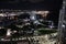 A Ferris wheel in the evening in Miami\\\'s harbor, lit up.