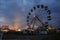 Ferris wheel at the fair at sunset