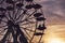 Ferris wheel funfair sunset