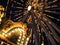 Ferris Wheel and Merry-go-round in an amusement park at night lit up with bright lights