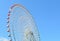 Ferris wheel over blue sky