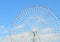 Ferris wheel over blue sky