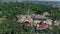 Ferris wheel in the park, aerial view. A large ferris wheel in the middle of a green park filming with a drone