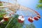 Ferris wheel in park on blue sky background view from down. Summer entertainment.