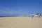 Ferris wheel and the Pier at Scheveningen beach in autumn, Den Hague, the Netherlands, with empty beach chairs