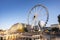 Ferris Wheel in Place Poelaert, near the Palace of Justice, in Brussels, in sunset light