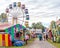 Ferris Wheel And Stalls At Country Fair