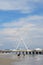 The Ferris Wheel at Steel Pier and family playing on beach