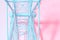 Ferris wheel steel structure in pastel pink and blue neon lighting