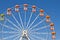 Ferris wheels and blue sky in the background