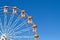 Ferris wheels and blue sky in the background