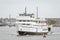 Ferry Anna C. leading string of boats out of New Bedford harbor