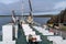 Ferry Baldur passengers sit on benches on the boat to sail to Flatey Island and the