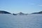 Ferry boat in Adriatic Sea with scenic blue sky and white clouds, near island Cres