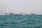 Ferry boat of Bay of Bengal smoke coming from its chimney. Black exhaust fumes coming from the chimney of a moored tanker.